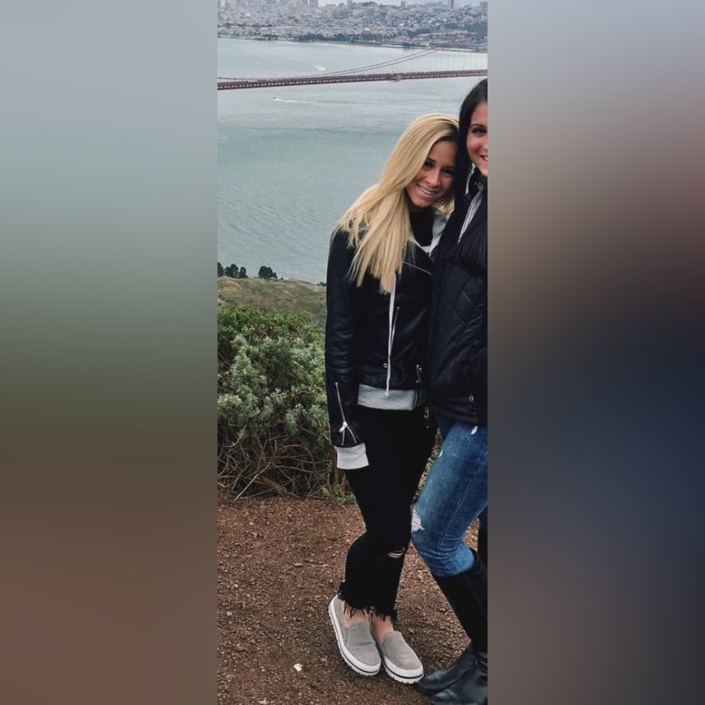 black leather jacket with gray hoodie stitched inside